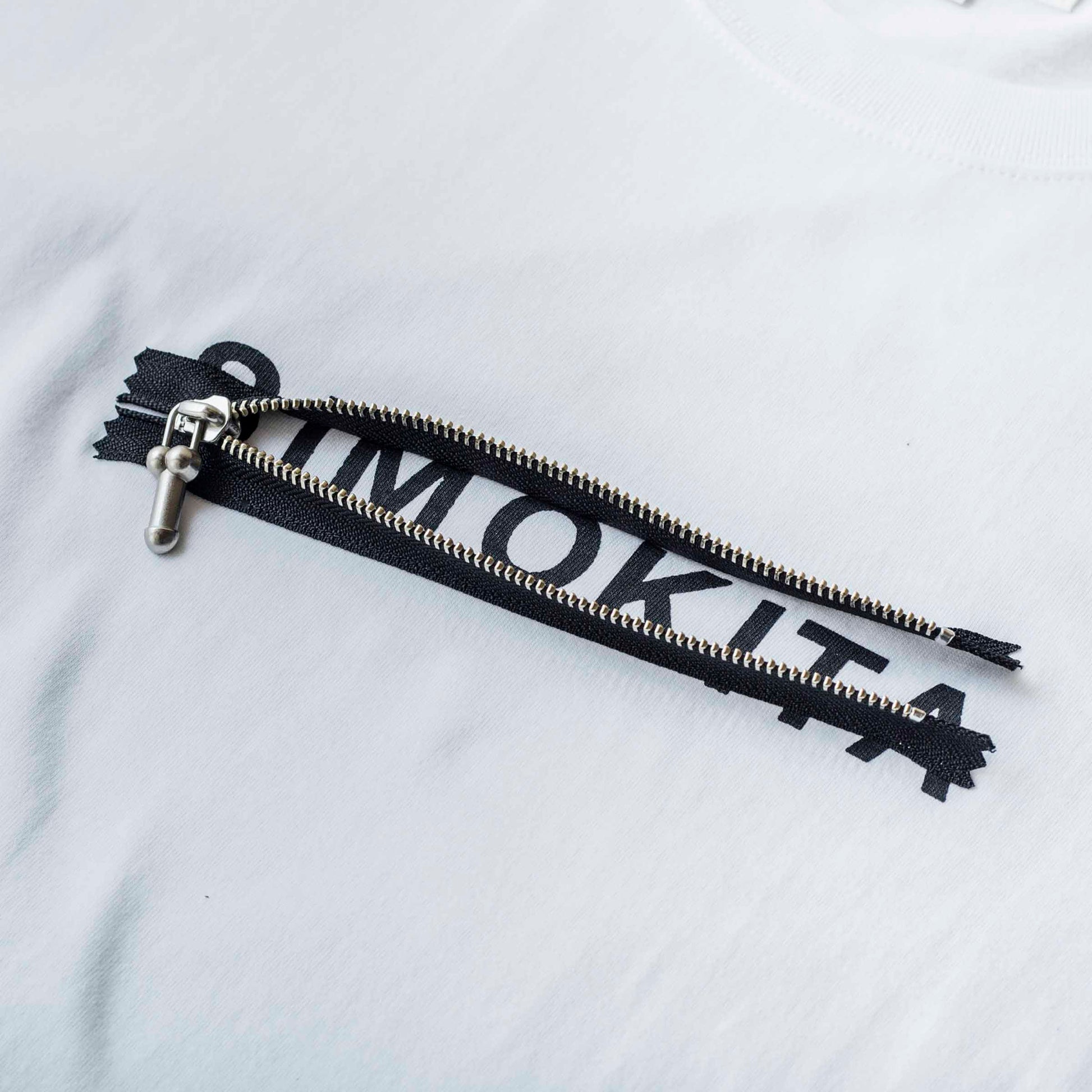 P-Zip Tee Si by PHINGERIN sold at nation Osaka.